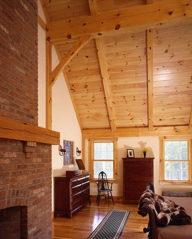 timber frame bedroom with fireplace