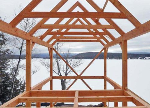 vermont timber frame being built in the winter in the northeast kingdom