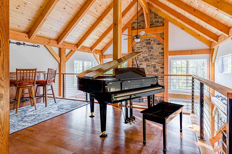 timber frame loft with piano
